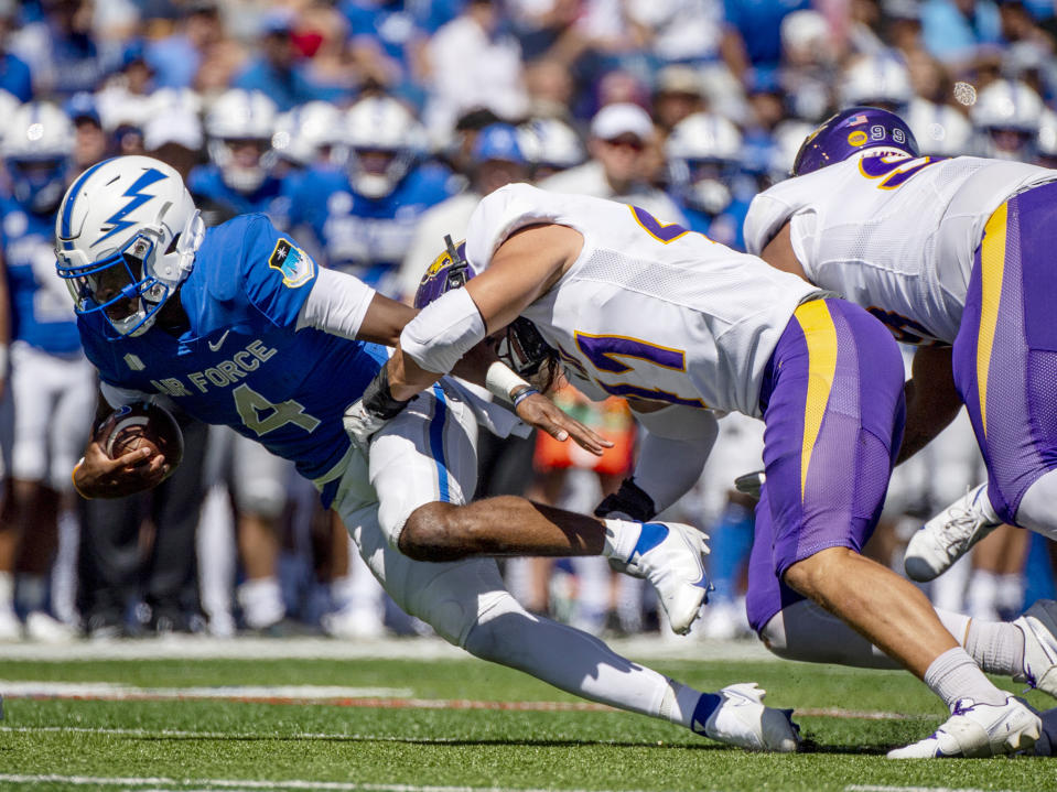 Air Force quarterback Haaziq Daniels (4) is sacked by Northern Iowa running back Kendall Robinson (31) during an NCAA college football game Saturday Sept. 3, 2022, in Colorado Springs, Colo. (Parker Seibold/The Gazette via AP)