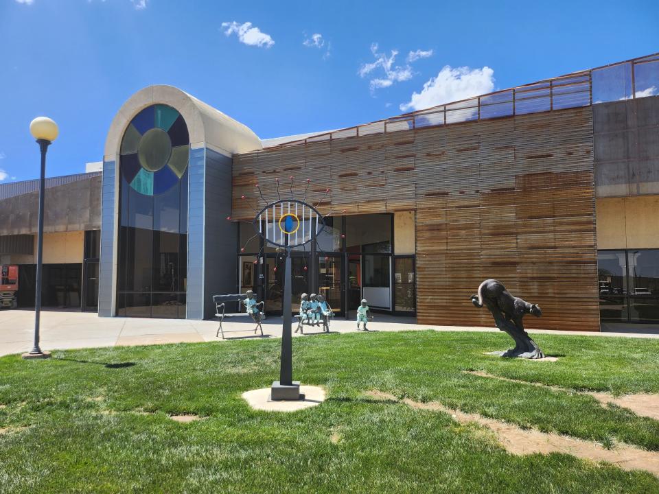 The Amarillo Art Institute and local artists celebrate the soft opening for the Arts in the Sunset Center, after two years of renovations, during Friday afternoon's ribbon cutting and reception.