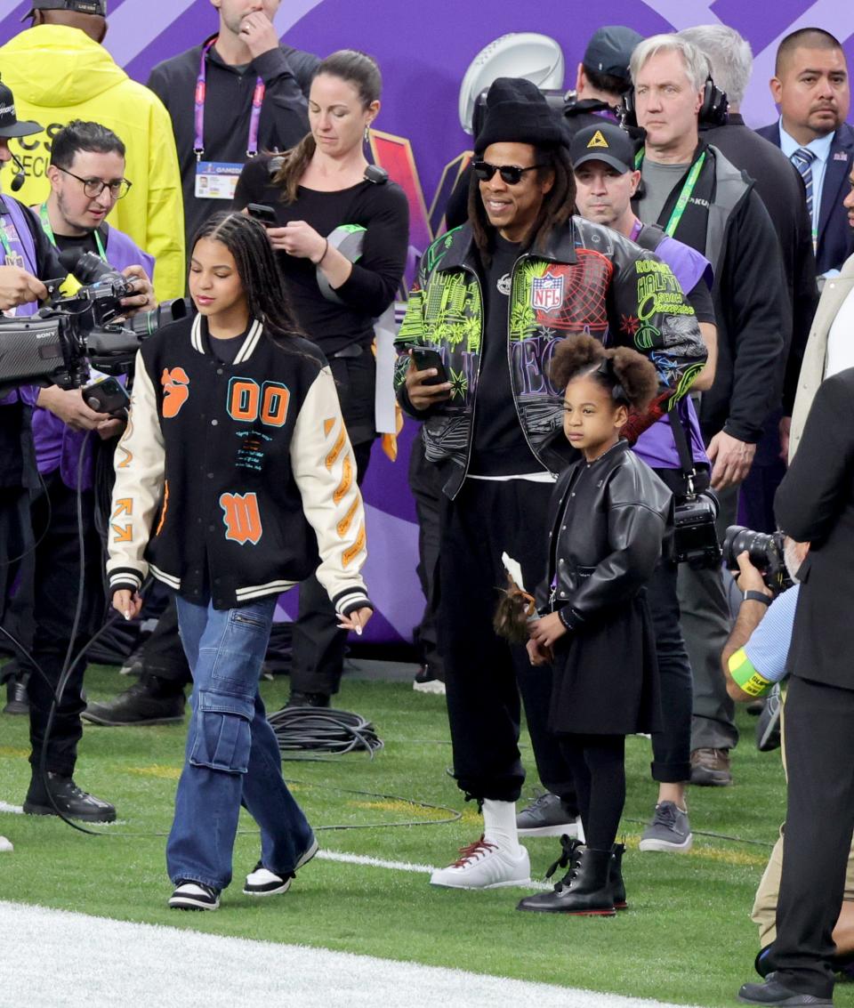 Blue Ivy Carter, Jay-Z and Rumi Carter are seen prior to the Super Bowl at Allegiant Stadium on Feb. 11, 2024, in Las Vegas, Nevada.