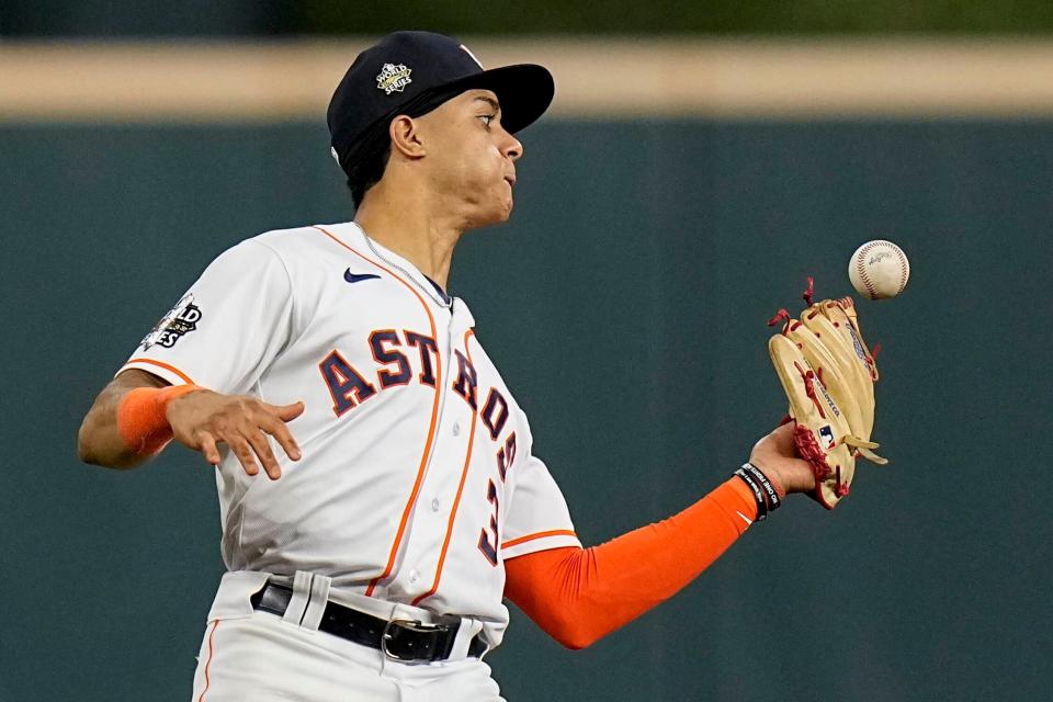 Astros shortstop Jeremy Peña catches a fly ball hit by Philadelphia Phillies' Rhys Hoskins during the ninth inning in Game 1 of baseball's World Series between the Houston Astros and the Philadelphia Phillies on Friday, Oct. 28, 2022, in Houston.