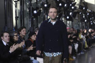 Creative director Bruno Sialelli walks on the stage after the presentation of Lanvin Mens Fall/Winter 2020-2021 fashion collection Sunday, Jan. 19, 2020 in Paris. (AP Photo/Thibault Camus)