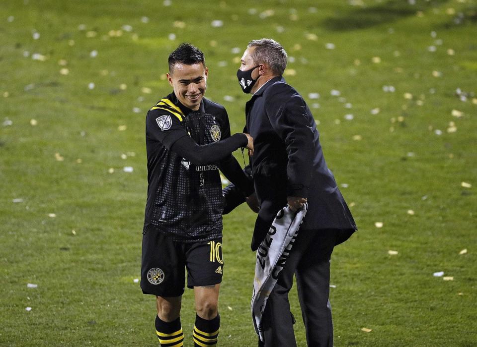 Lucas Zelarayan and coach Caleb Porter celebrate after winning the 2020 MLS Cup.