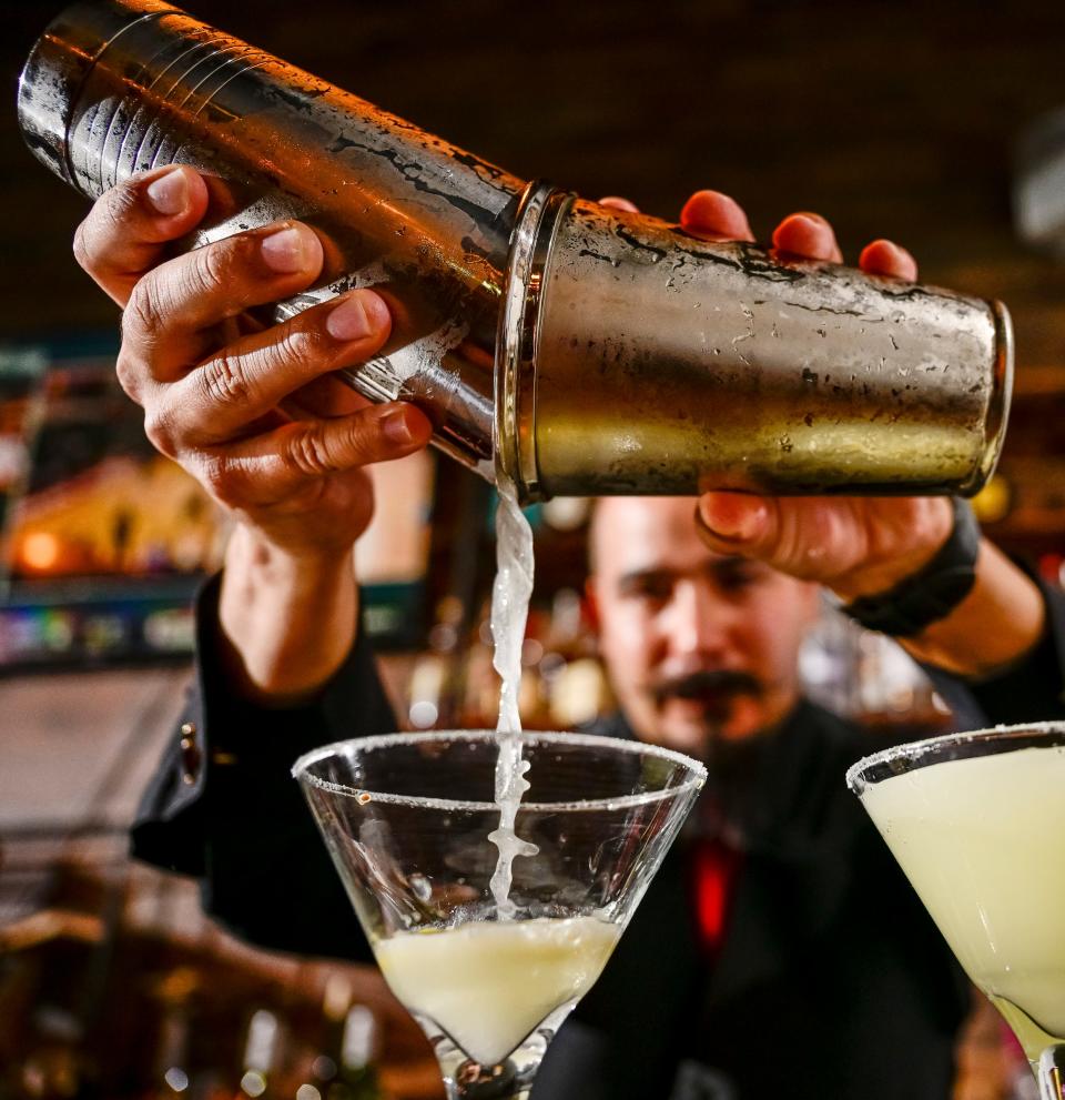 Gabriel Magana works the back bar at Nash's Steakhouse on Thursday, July 14, 2022. The restaurant opened next to Garden Street Plaza in early June.