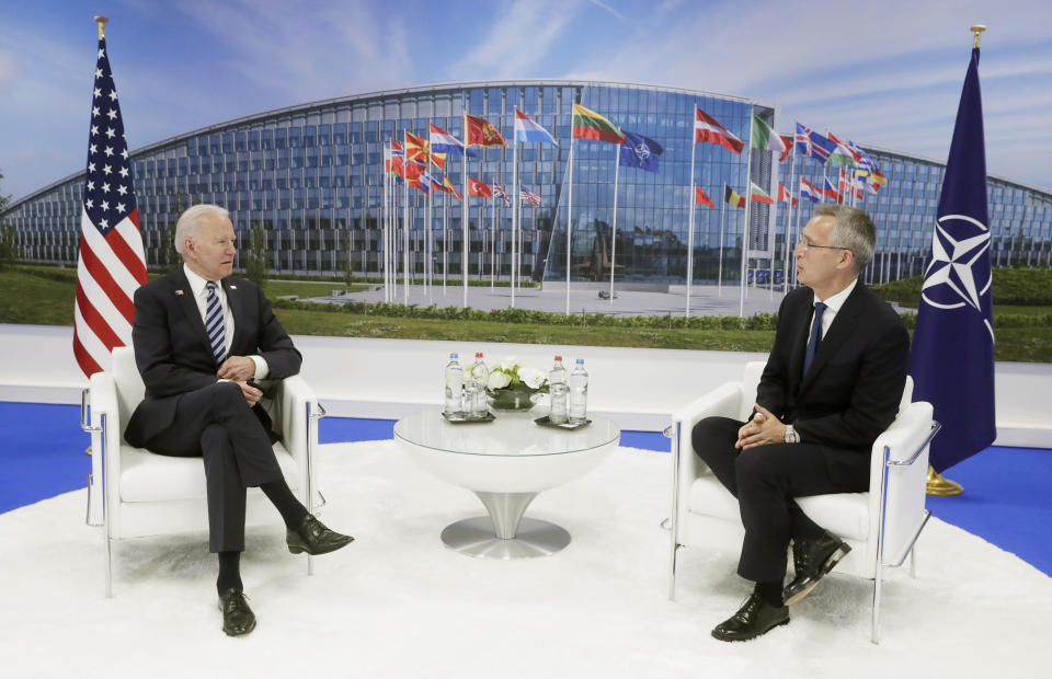 NATO Secretary General Jens Stoltenberg speaks with U.S. President Joe Biden during a bilateral meeting on the sidelines of a NATO summit at NATO headquarters in Brussels, Monday, June 14, 2021. U.S. President Joe Biden is taking part in his first NATO summit, where the 30-nation alliance hopes to reaffirm its unity and discuss increasingly tense relations with China and Russia, as the organization pulls its troops out after 18 years in Afghanistan. (Stephanie Lecocq, Pool via AP)