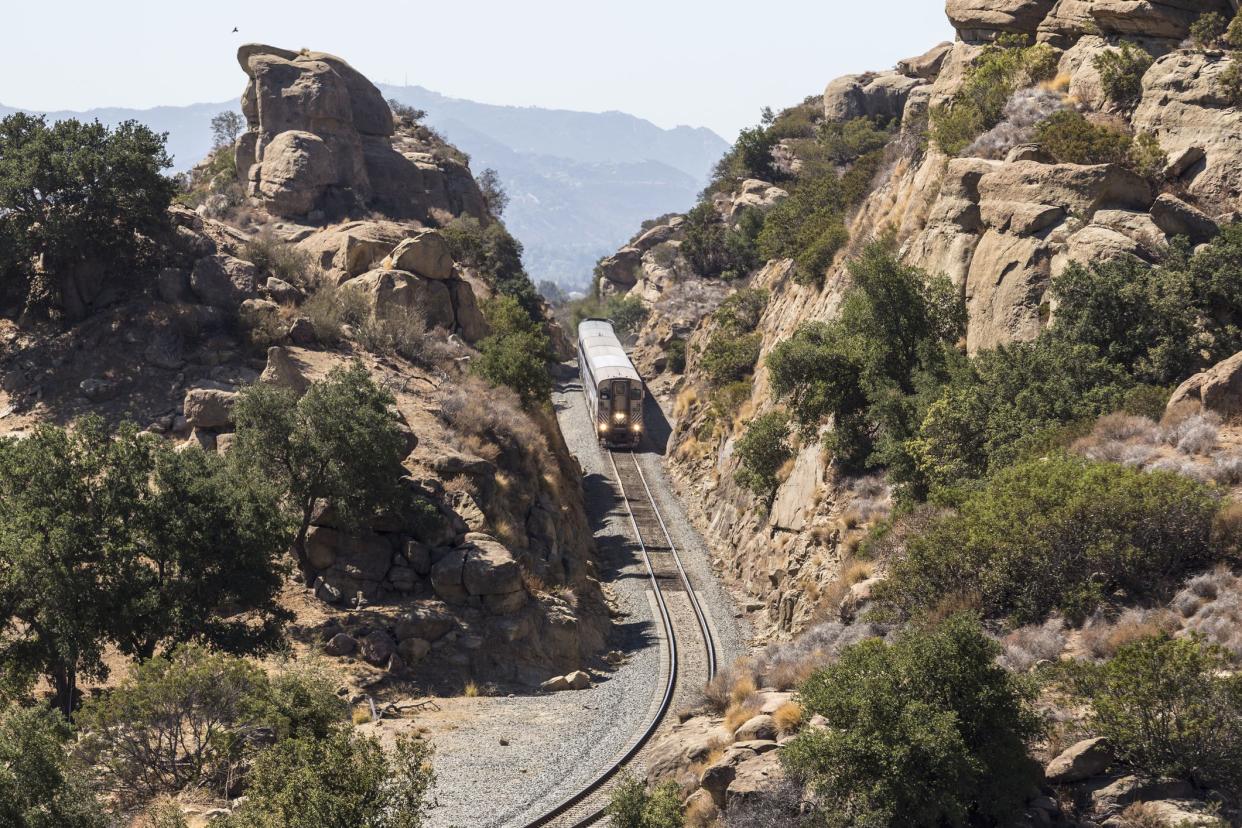 Los Angeles, California, USA - September 29, 2014:  Amtrak Surfliner train passing through the Santa Susana Pass on the edge of the city of Los Angeles.