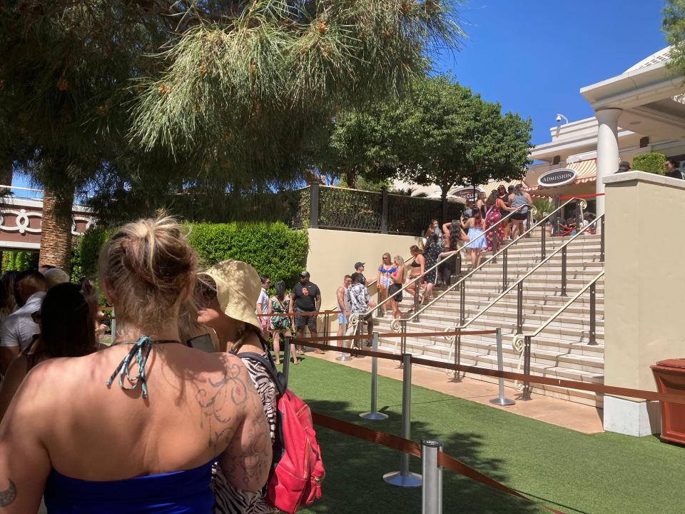 Guests line up to enter Encore Beach Club on April 2.