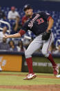 Washington Nationals relief pitcher Ryne Harper (33) catches a ball hit by Miami Marlins' Lewin Diaz (68) during the eighth inning of a baseball game, Wednesday, Sept. 22, 2021, in Miami. (AP Photo/Marta Lavandier)