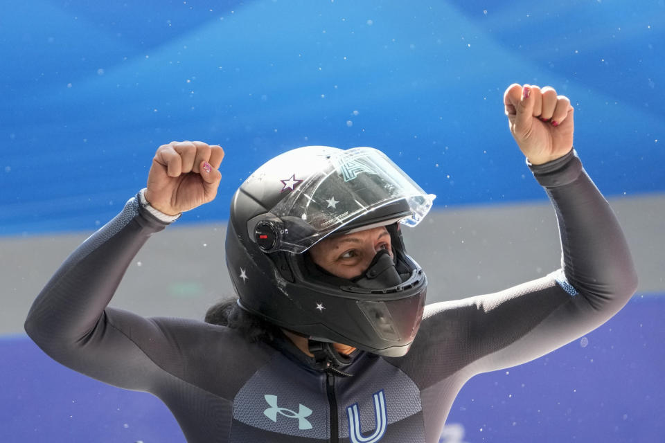 FILE- Elana Meyers Taylor, of the United States, celebrates after the women's monobob heat 4 at the 2022 Winter Olympics, Monday, Feb. 14, 2022, in the Yanqing district of Beijing. “I never really wanted to break any of them,” she said when her fourth Olympic medal passed teven Holcomb's U.S. record “He’s part of the reason I’m here to begin with. He guided me through most of my career. I wouldn’t be here without him. That’s all I can say. To be in that kind of company is just incredible.” (AP Photo/Pavel Golovkin, File)