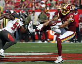 <p>Washington Redskins wide receiver Michael Floyd (17) reaches for the ball after getting around Tampa Bay Buccaneers outside linebacker Lavonte David (54) during the first half of an NFL football game Sunday, Nov. 11, 2018, in Tampa, Fla. (AP Photo/Mark LoMoglio) </p>