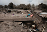 <p>Alejandro Esqueque, 45, looks for the remains of his mother and nephews at his home, in the area affected by the eruption of the Fuego volcano at San Miguel Los Lotes in Escuintla, Guatemala, June 6, 2018. REUTERS/Carlos Jasso – RC1485C03000 </p>