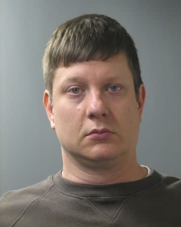 Chicago police officer Jason Van Dyke is seen in an undated picture released by the Cook County State's Attorney's Office in Chicago, Illinois. Van Dyke was charged on Tuesday with first-degree murder in the October 2014 shooting of a black teenager, a state prosecutor said in a statement. REUTERS/Cook County State's Attorney's Office/Handout via Reuters