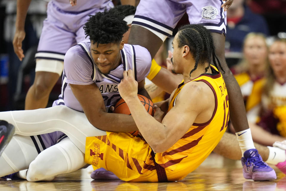 Kansas State forward Jerrell Colbert fights for a loose ball with Iowa State forward Robert Jones (12) during the first half of an NCAA college basketball game, Wednesday, Jan. 24, 2024, in Ames, Iowa. (AP Photo/Charlie Neibergall)