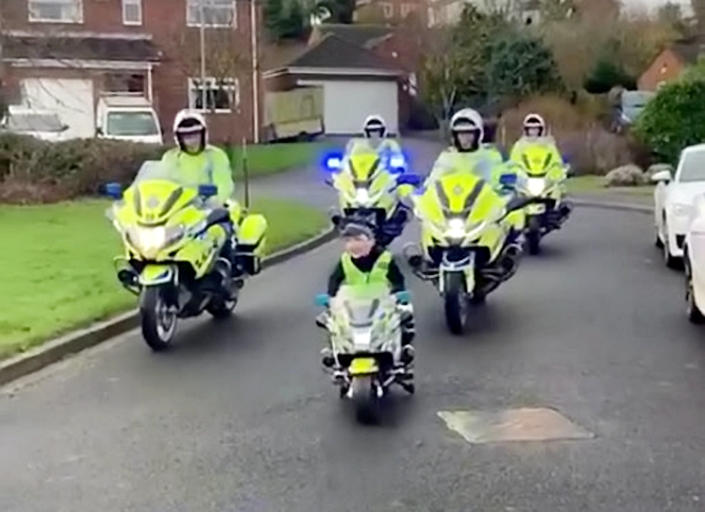 Harry Farrell became an honorary motorbike police officer for the day. (SWNS)