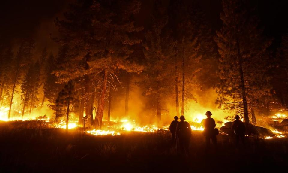 firefighters looking on at a fire