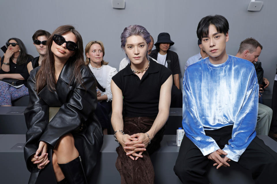 PARIS, FRANCE - JUNE 24: (L-R) Emily Ratajkowski, Taeyong and Hu Yitan attend the Loewe Menswear Spring/Summer 2024 show as part of Paris Fashion Week on June 24, 2023 in Paris, France. (Photo by Pascal Le Segretain/Getty Images for Loewe)
