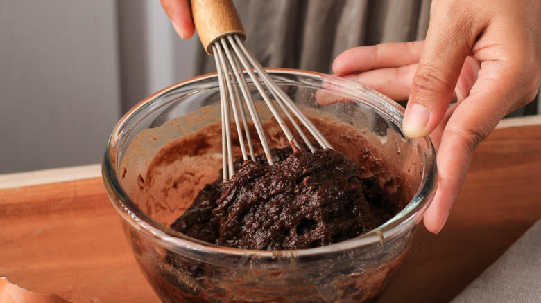 Mixing brownie batter in bowl