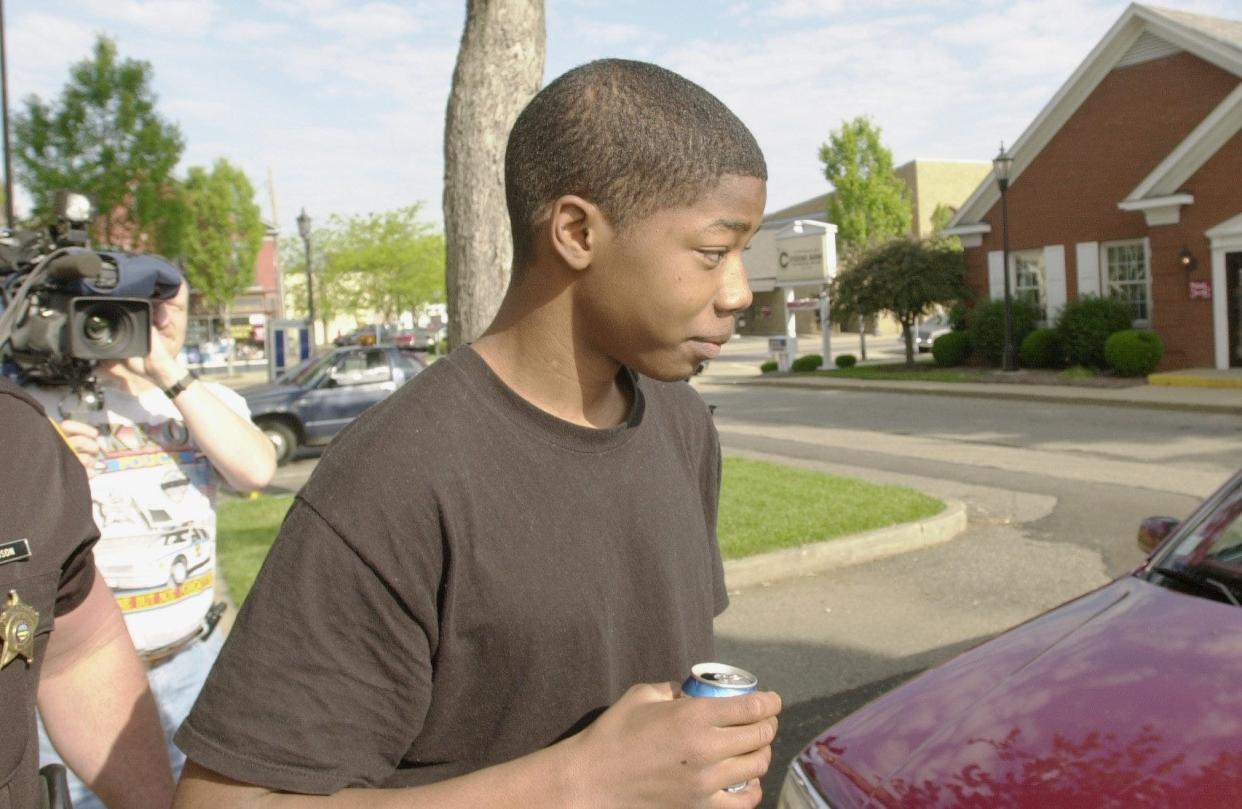 Anthony Harris, then 14, is shown leaving Tuscarawas County Juvenile Court after the 5th District Court of Appeals overturned his conviction for 5-year-old Devan Duniver's 1998 stabbing. The court made its decision on June 7, 2000.