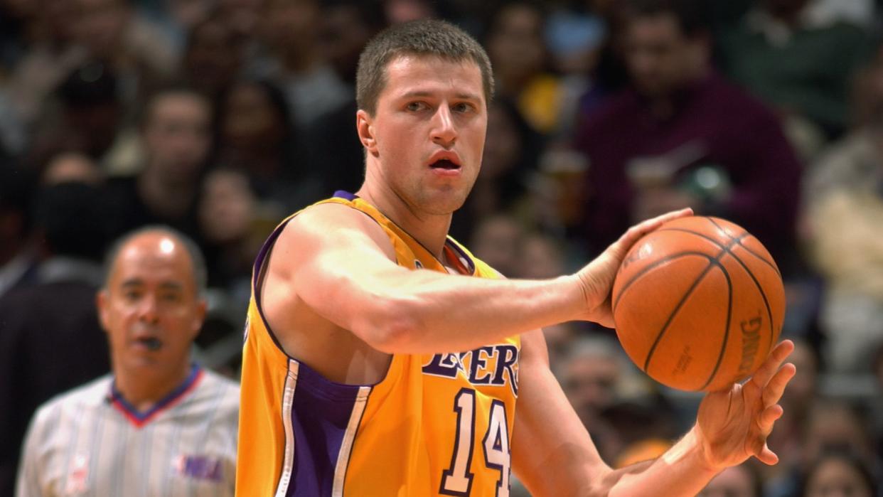 LOS ANGELES - DECEMBER 16: Stanislav Medvedenko #14 of the Los Angeles Lakers dribbles the ball the NBA game against the Golden State Warriors at the Staples Center in Los Angeles, California. The Lakers won, 101-85. DIGITAL IMAGE. NOTE TO USER: User expressly acknowledges and agrees that, by downloading and/or using this Photograph, User is consenting to the terms and conditions of the Getty Images License Agreement. (Photo by Robert Mora/NBAE via Getty Images)