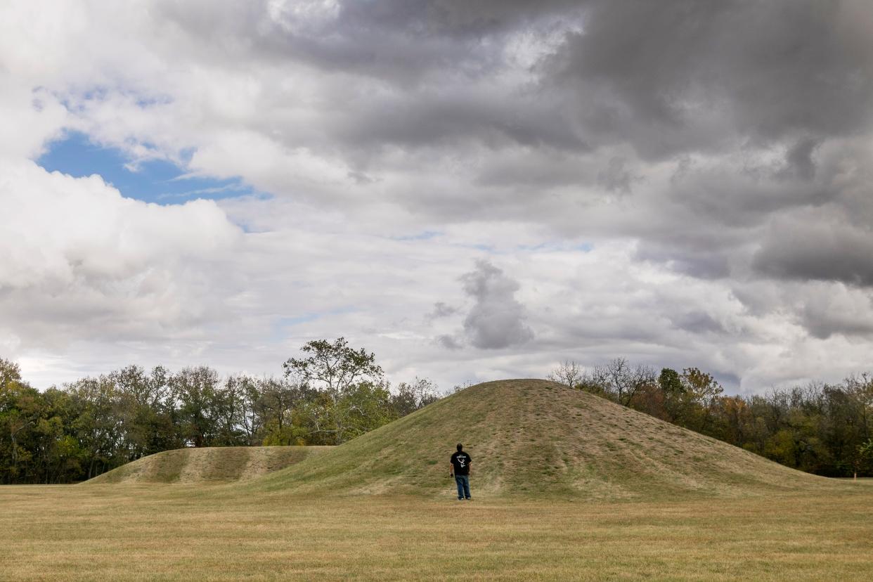 Culture and Historic Preservation Director of then Seneca Cayuga Nation, William, of Grove, Oklahoma, stands in front of one of the mounds at the Hopewell Culture National Historical Park before the start of the Hopewell Ceremonial Earthworks UNESCO World Heritage Inscription on October 14, 2023, in Chillicothe, Ohio.