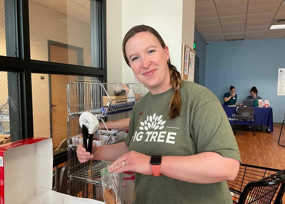 Volunteer Anna Lee packs doughnuts to go for a client at Fig Tree, a homeless community outreach program sponsored by Cokesbury United Methodist Church, on June 1, 2022.