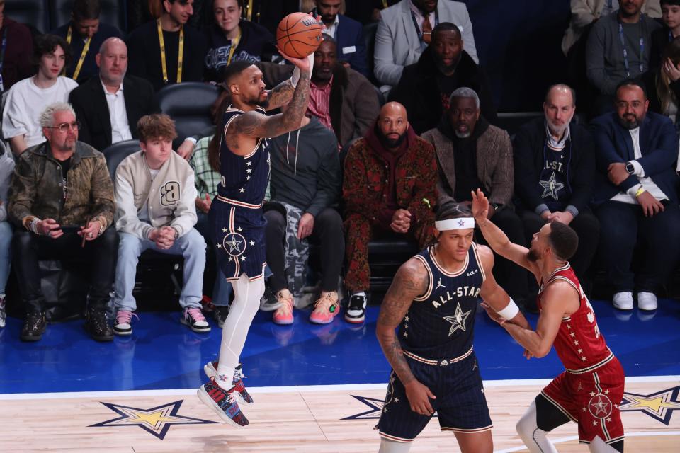 Bucks guard Damian Lillard launches a three-pointer during the first quarter of the NBA all-star game on Sunday night in Indianapolis.