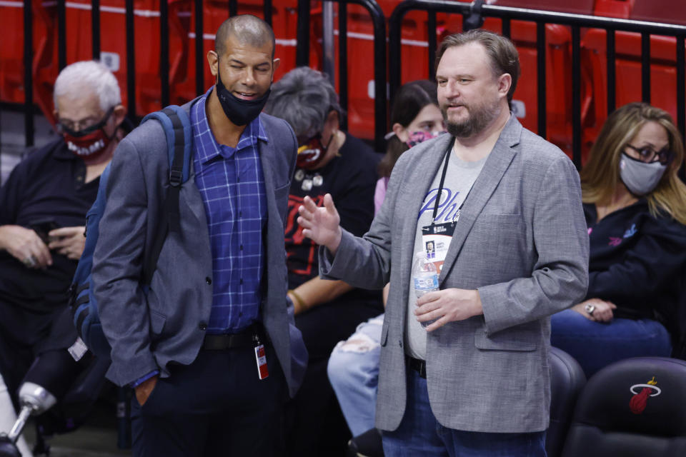 Former Miami Heat Shane Battier talks with Daryl Morey prior to a game.