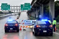 Police block the entrance of highway 17 due to the floods in Charleston, South Carolina on October 4, 2015