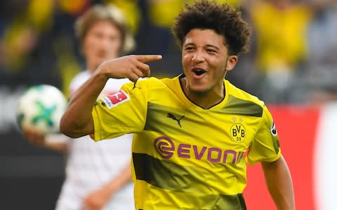 Jadon Sancho celebrates scoring for Borussia Dortmund  - Credit: AFP