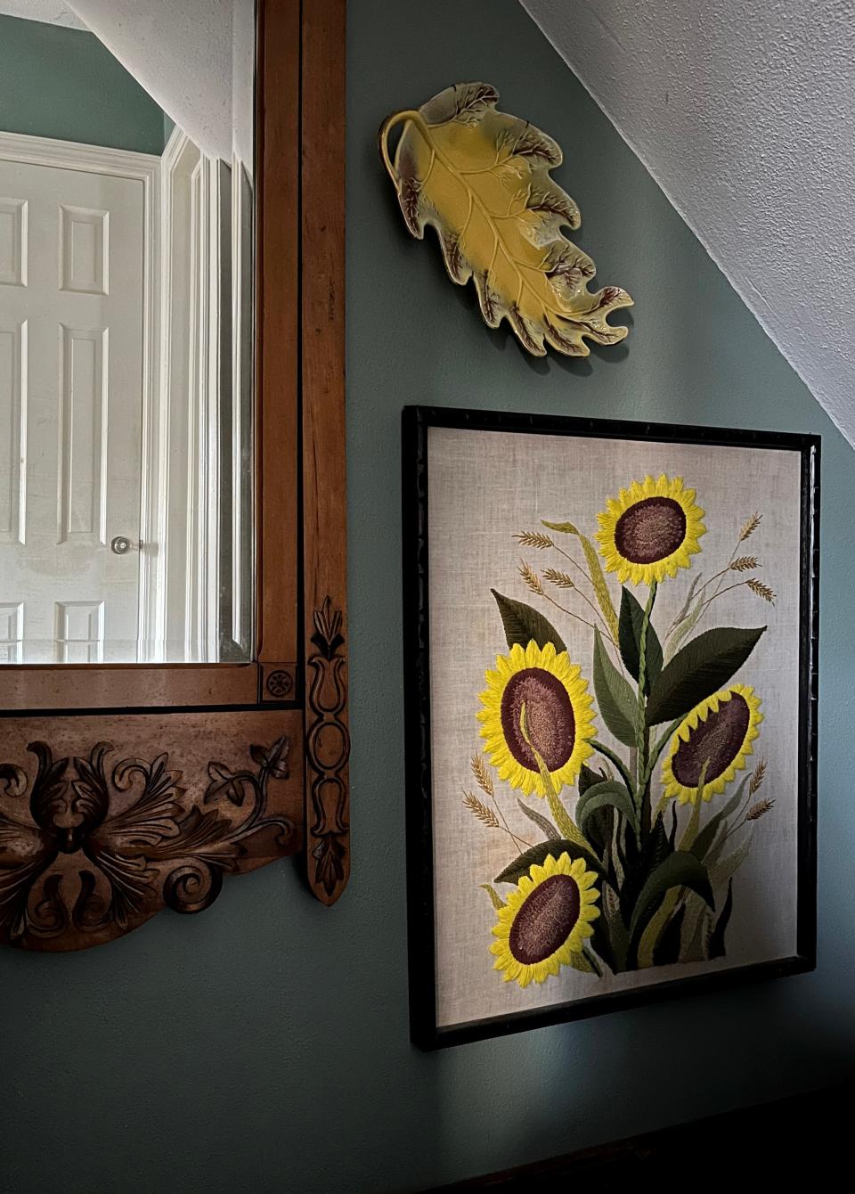 A gallery wall adds interested on a stairway.