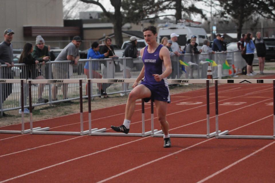 Southeast of Saline's Chase Poague sprints during the 300-meter hurdles in the Saline County Invitational Tuesday, March 29 2022 at Salina Stadium.