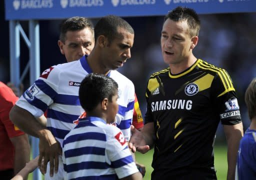 Anton Ferdinand (L) refuses to shake hands with John Terry before a match earlier this month. The two met at Wembley as Terry's FA disciplinary hearing over allegations he racially abused Ferdinand started