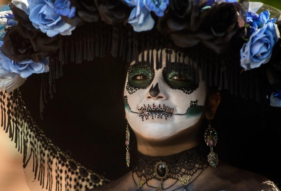 Francisca Reyes competes in the Catrina pageant at the annual Dia De Los Muertos Community Street Fiesta at the Mexican Heritage Center in downtown Stockton on Saturday, Oct. 29, 2022. 