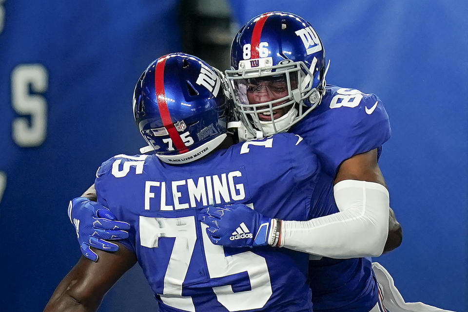 New York Giants wide receiver Darius Slayton (86) celebrates with offensive tackle Cameron Fleming (75) after scoring a touchdown against the Pittsburgh Steelers during the second quarter of an NFL football game Monday, Sept. 14, 2020, in East Rutherford, N.J. (AP Photo/Seth Wenig)