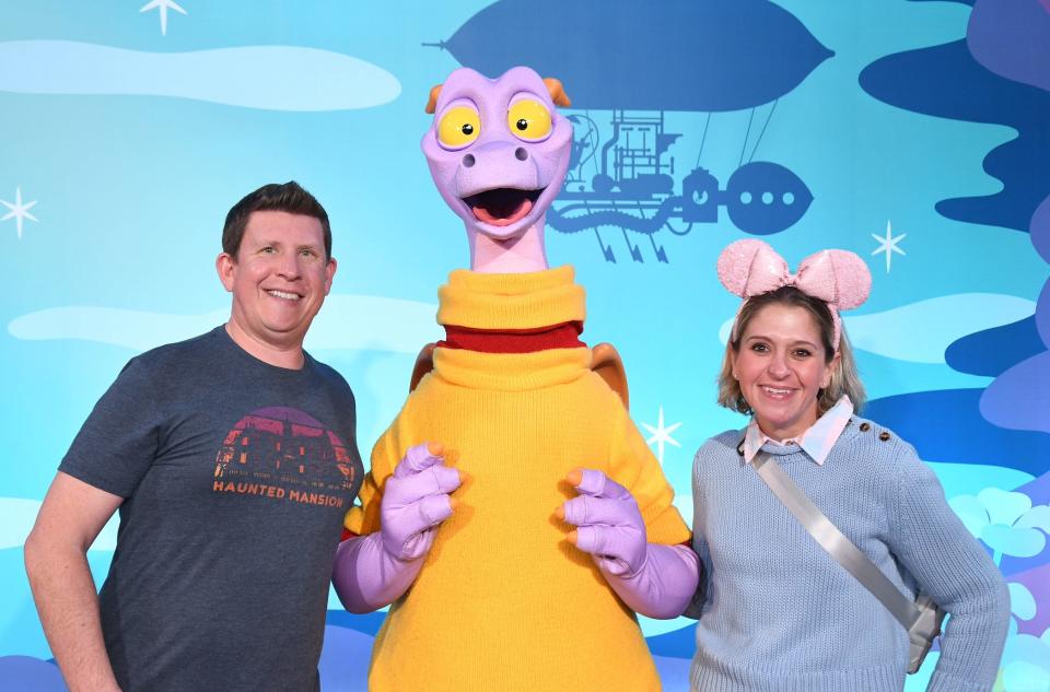 terri and her husband posing with figment at epcot