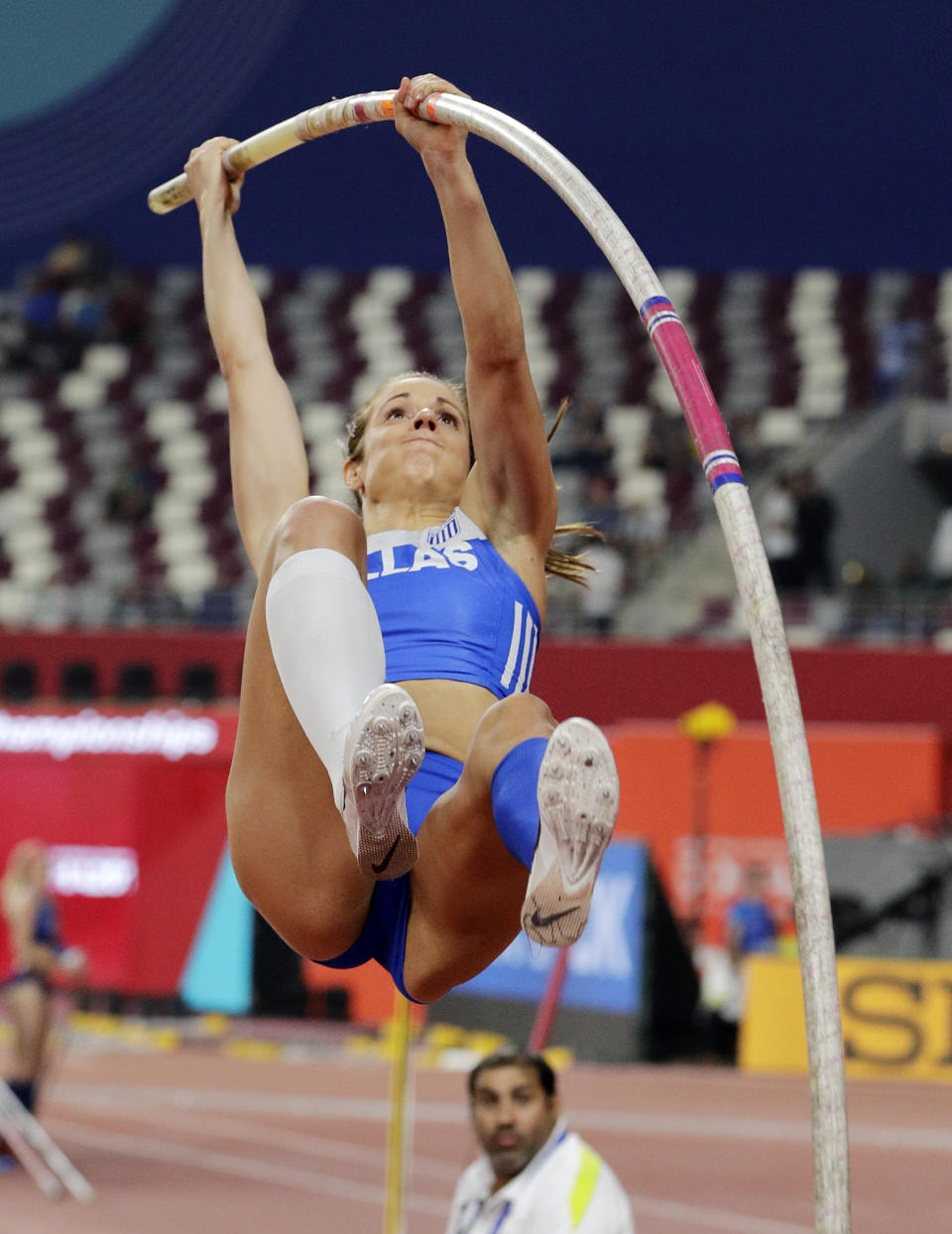 FILE - In this Sept. 29, 2019, file photo, Katerina Stefanidi, of Greece, competes in the women's pole vault final at the World Athletics Championships in Doha, Qatar. Three of the leading women’s pole vaulters will take their turn to compete in the second edition of the Ultimate Garden Clash. Katerina Stefanidi of Greece, Katie Nageotte of the United States and Alysha Newman of Canada will participate in the event but won’t be competing in their backyards since they don’t have the equipment at home. They will instead be at nearby training facilities.(AP Photo/Hassan Ammar, File)