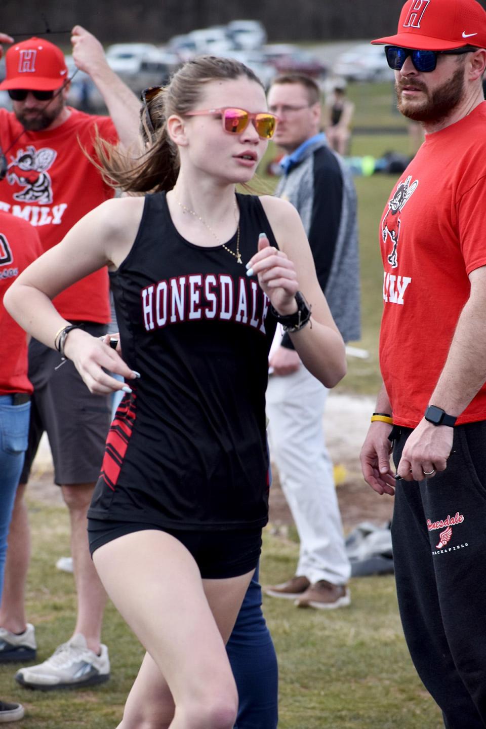 Brenna Dahlgren of Honesdale brings home the gold against Western Wayne in the 3200M with a time of 12:11.