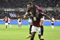Torino's Duvan Zapata, bottom, celebrates after scoring the 1-0 goal for his team , during the Serie A soccer match between Torino and AC Milan, Saturday, May 18, 2024, at the Olimpico Grande Torino Stadium in Turin, Italy. (Tano Pecoraro/LaPresse via AP)