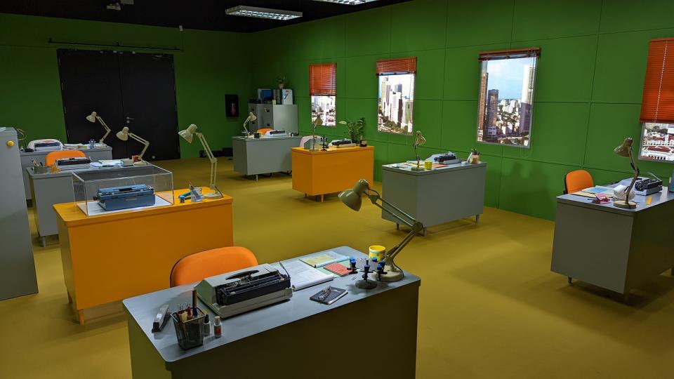 A replica of an office in the 1970s with desks and typewriters, having yellow floor and green walls. (Photo: Yahoo Lifestyle Singapore)