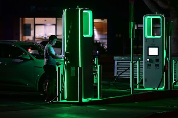 PHOTO: A driver charges his electric vehicle at a charging station as the California Independent System Operator announced a statewide electricity Flex Alert urging conservation to avoid blackouts, Aug. 31, 2022, in Monterey Park, Calif. (Frederic J. Brown/AFP via Getty Images)