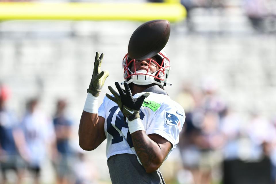 Patriots wide receiver Jakobi Meyers, catching a pass during Friday's training camp session at Gillette Stadium, has had to relearn the playbook because of the change in terminology this year.