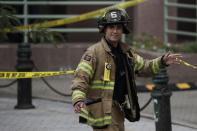 <p>An emergency official walks near the Hoboken Terminal following a train crash, Thursday, Sept. 29, 2016, in Hoboken, N.J. (AP Photo/Julio Cortez) </p>