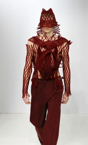 Planet Fashion calling Earth: Designer Craig Brown wove rubber mesh around his models like that used to wrap fruit