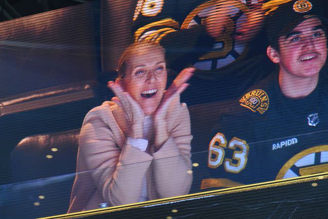 <p>Steve Babineau/NHLI via Getty</p> Céline Dion attends Boston Bruins and New York Rangers game with her sons Nelson and Eddy.