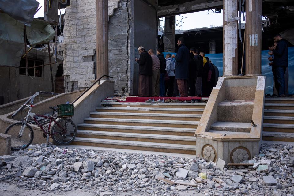 Palestinians pray in a damaged mosque following an Israeli strike in Rafah, southern Gaza Strip, on Feb. 15, 2024.