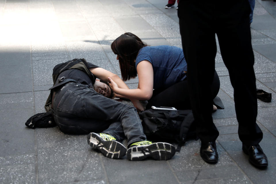 <p>An injured man is seen on the sidewalk in Times Square after a speeding vehicle struck pedestrians on the sidewalk in New York City on May 18, 2017. (Mike Segar/Reuters) </p>