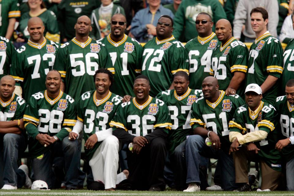 Former Packers safety LeRoy Butler (36) joins his fellow Super Bowl XXXI teammates during a ceremony prior to the team's game against the Bears, Sept. 10, 2006 at Lambeau Field in Green Bay, Wis.
