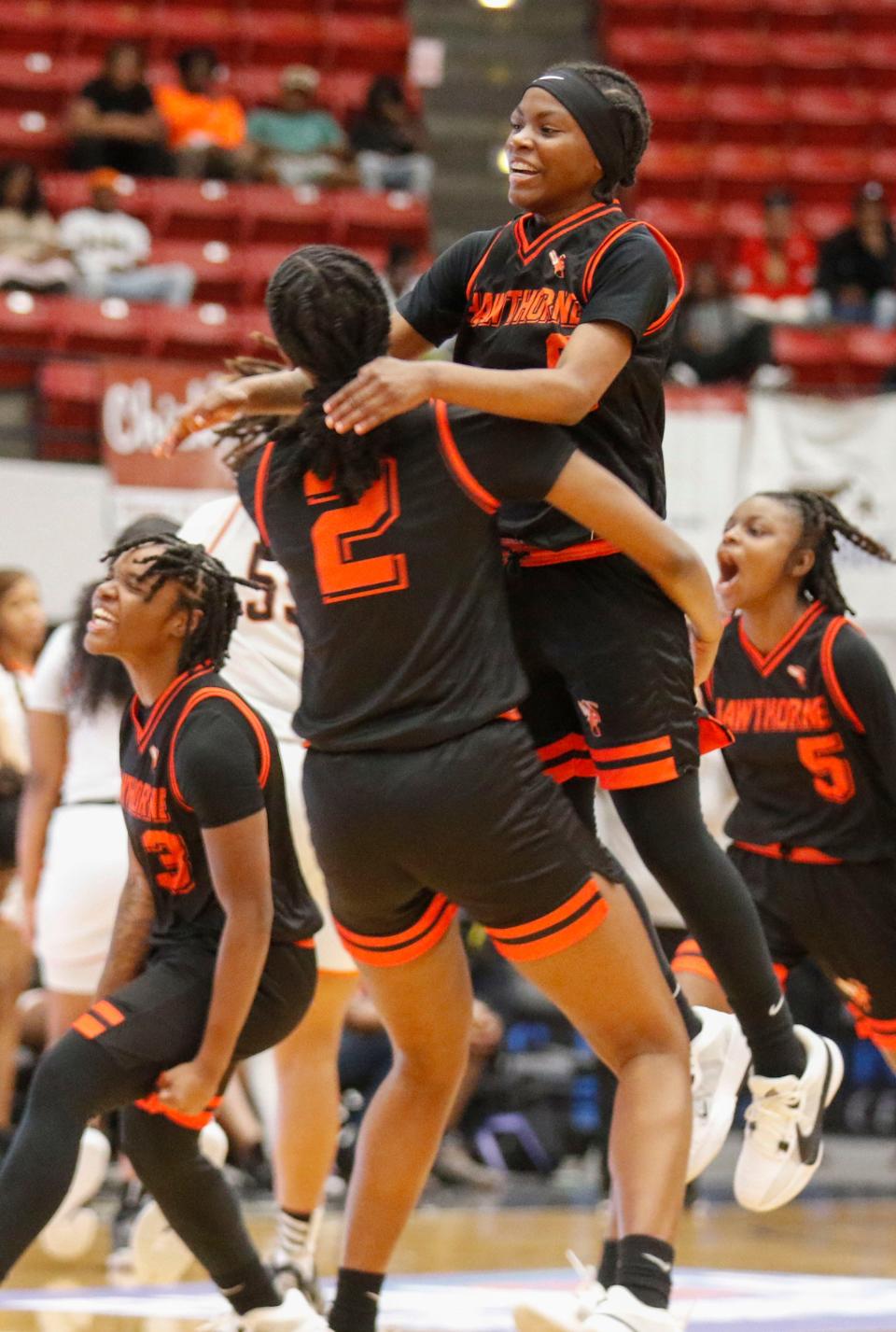 Hornets #0 De’Mya Adams leaps into the arms of teammate #2 Ashlyn Coleman as the buzzer rings. Hawthorne Hs Hornets defeated the Graceville Tigers at the FHSAA Girls 1A Championship at the RP Funding Center in Lakeland Fl. Saturday March 2nd 2024, 2024 Photo by Calvin Knight