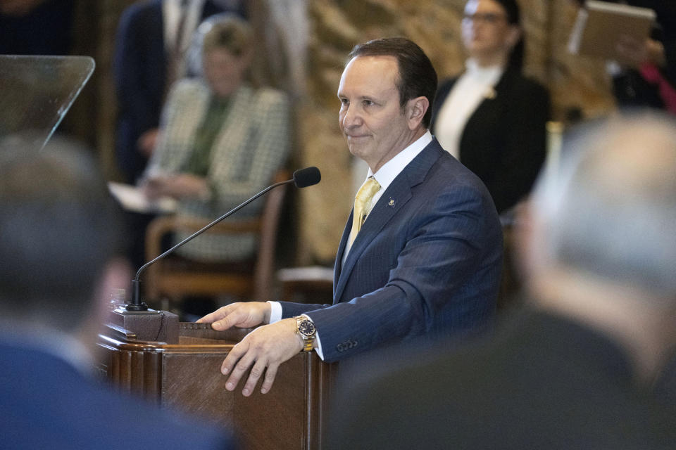 Louisiana Gov. Jeff Landry pauses during a standing ovation as he addresses members of the House and Senate on opening day of a legislative special session focusing on crime, Monday, Feb. 19, 2024, in the House Chamber at the State Capitol in Baton Rouge, La. (Hilary Scheinuk/The Advocate via AP)