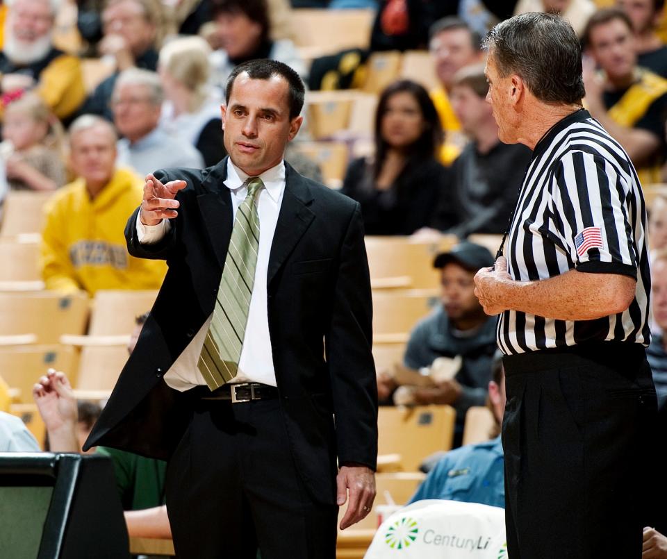 Northwest Missouri State head coach Ben McCollum, left, argues at call with a referee during the first half of an NCAA college basketball exhibition game against Missouri, Monday, Oct. 29, 2012, in Columbia, Mo. Missouri won 91-58.