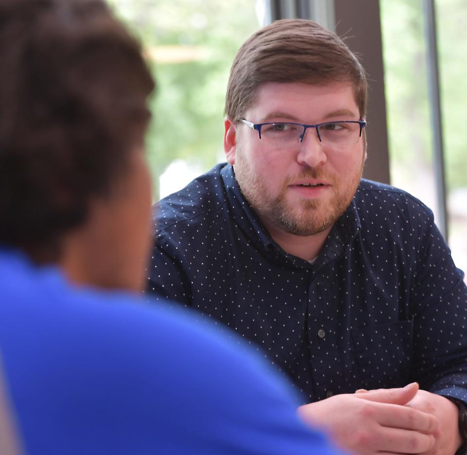 Spartanburg Methodist College financial aid director Kyle Wade talks about the FAFSA, one-on-one sessions available for high school seniors offered by the school. Here, a student, left, talks over the FAFSA information with Wade.